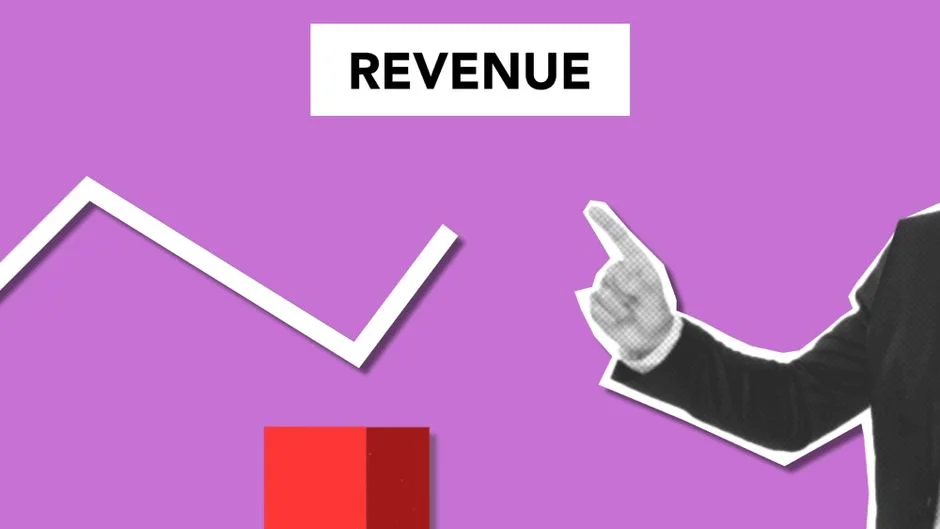 {'answer': 'Businessman pointing at an upward-trending revenue graph, illustrating 2026 revenue operations growth.'}